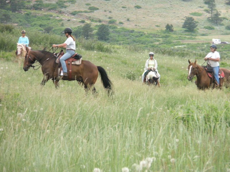 Sue Potter and Ann Coleman trail riding on our ranch