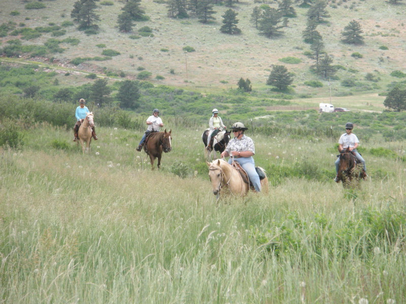 Kim on Prince leading a trail ride on our ranch