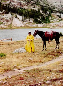 Kim wearing slicker with Chance at Lawn Lake RMNP